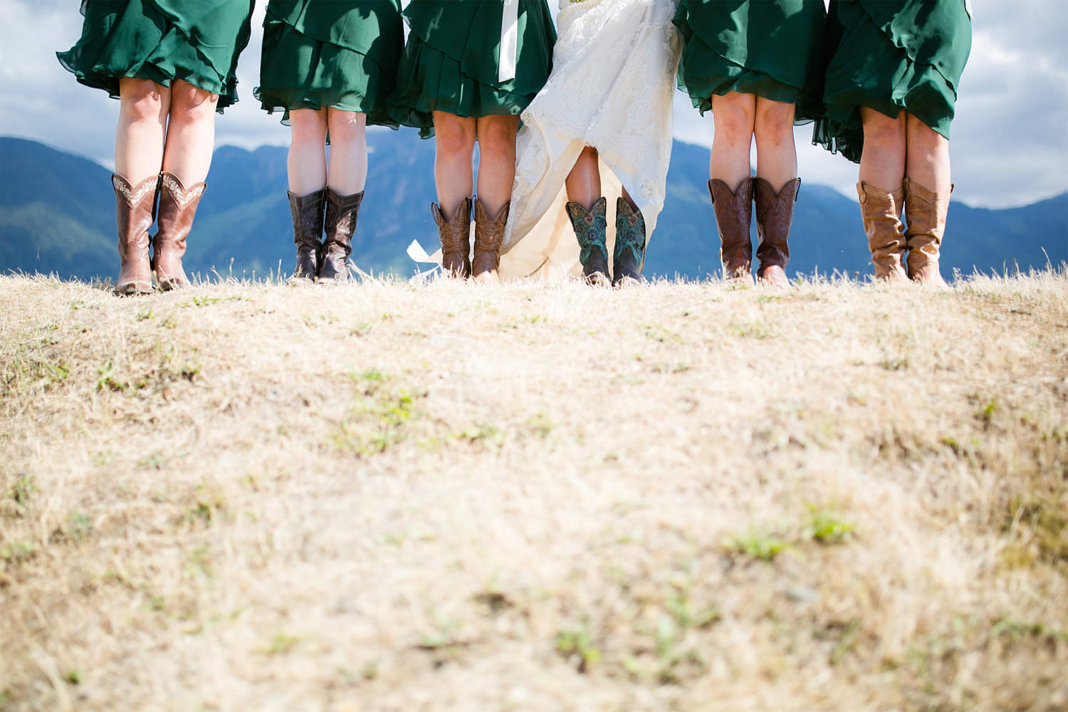 Detail shot of bridesmaids dresses and boots at Fraser River Fishing Lodge.