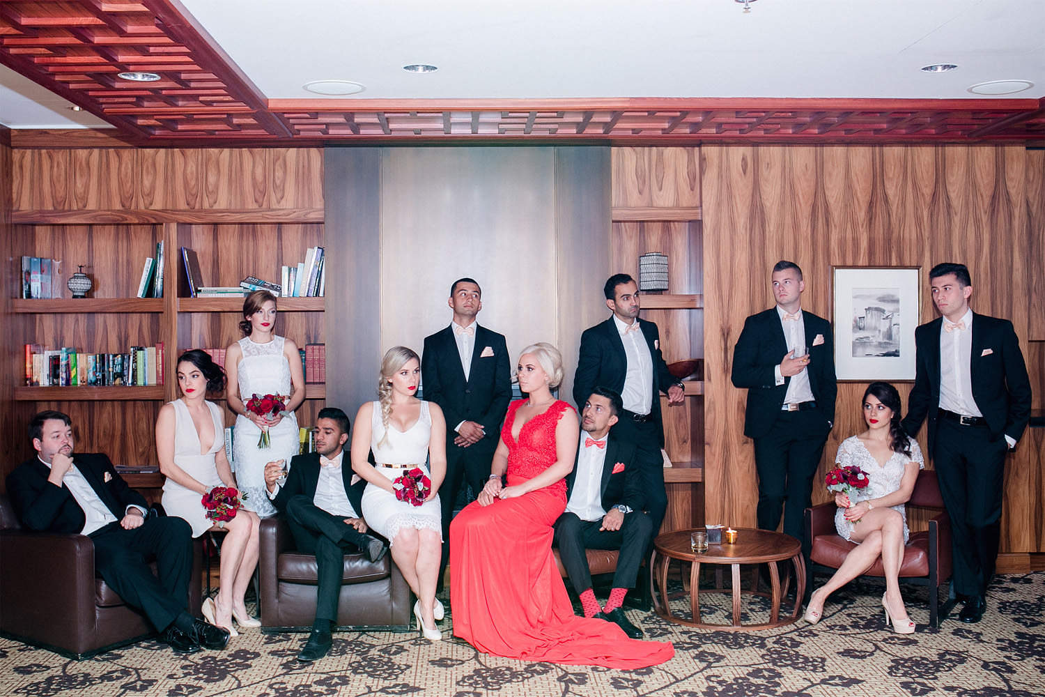 Bridal party posing in library of Shangri La Hotel in Vancouver.