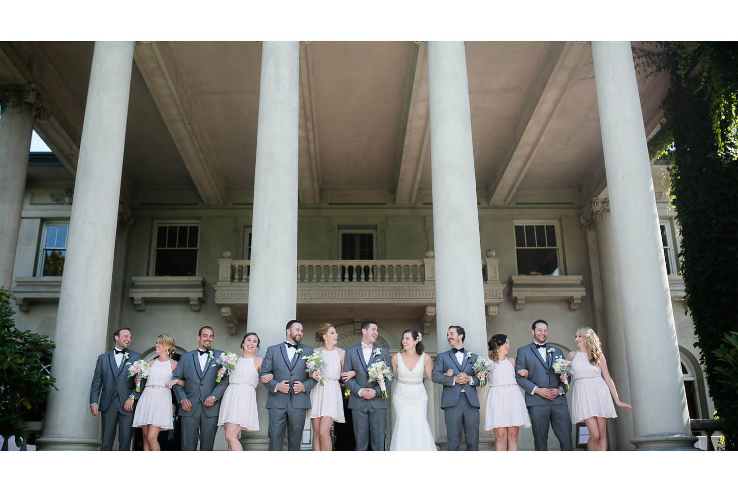 Bridal party posing on steps of Hycroft Manor during bridal party shots.