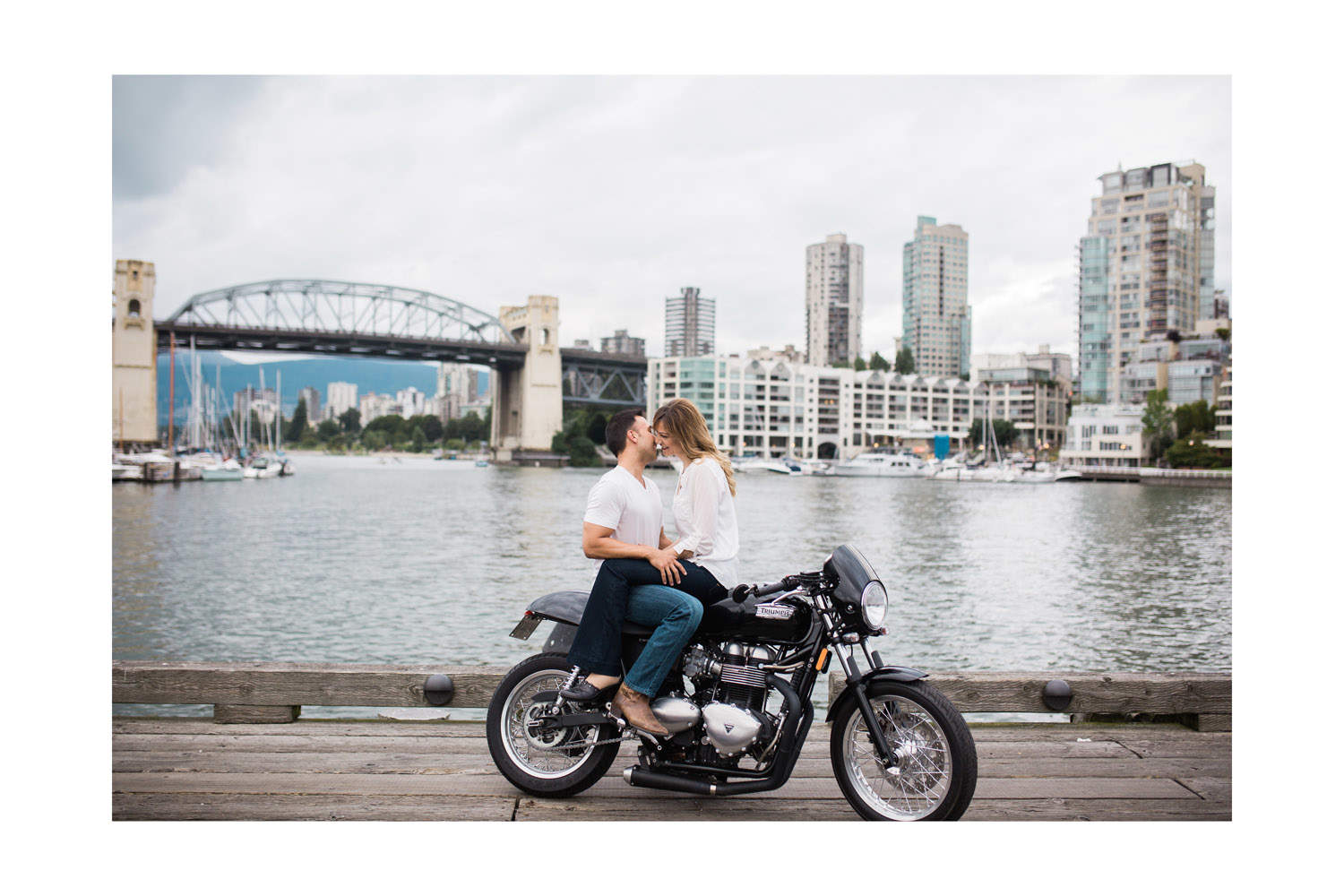 couple on motorcycle during engagement session at granville island