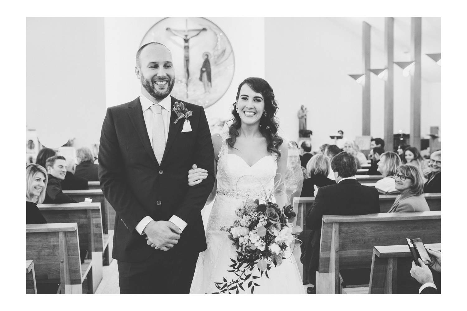 Vancouver wedding photographer image of the couple walking down the aisle after the ceremony.