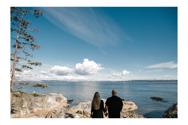 Couple posing during engagement session at Lighthouse Park.