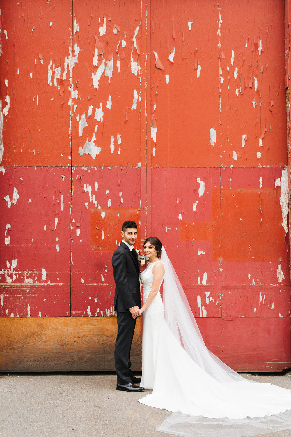 couple posing at their east vancouver italian wedding