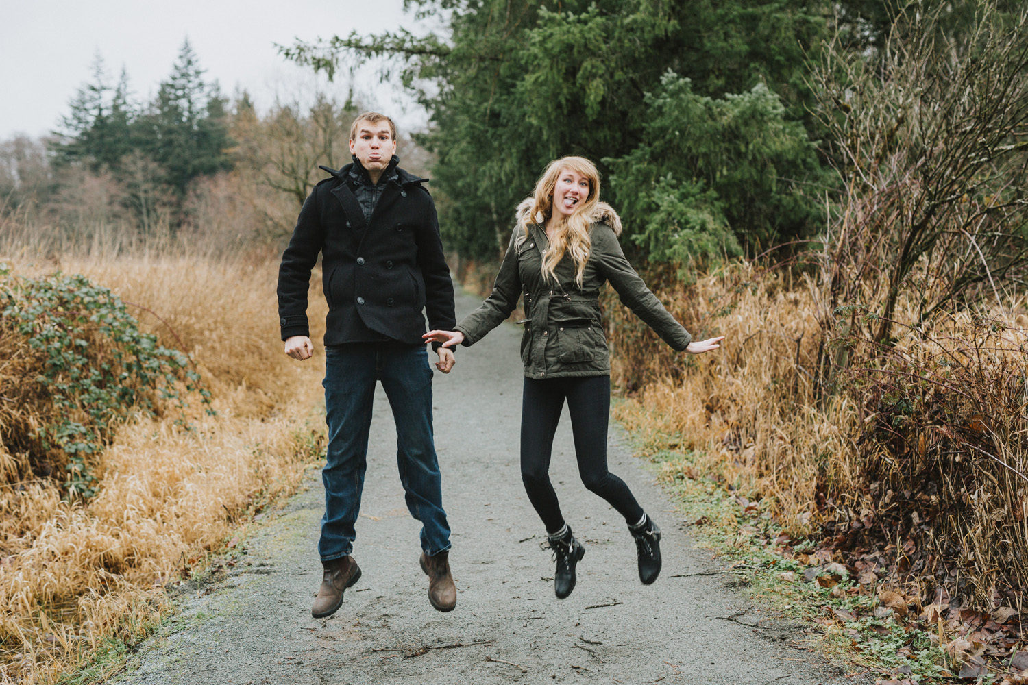 couple posing and having fun at campbell valley engagement jumping